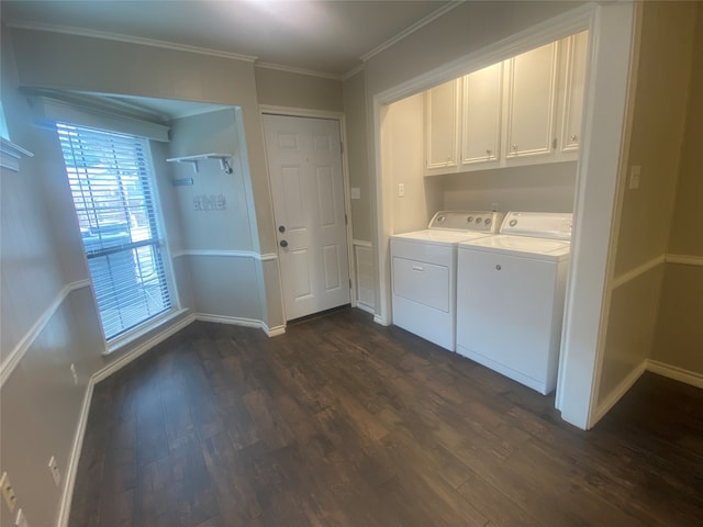 washroom with crown molding, dark hardwood / wood-style flooring, separate washer and dryer, and cabinets