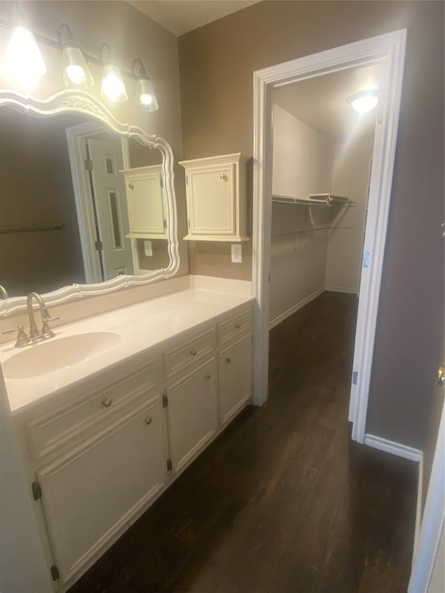 bathroom featuring hardwood / wood-style floors and vanity