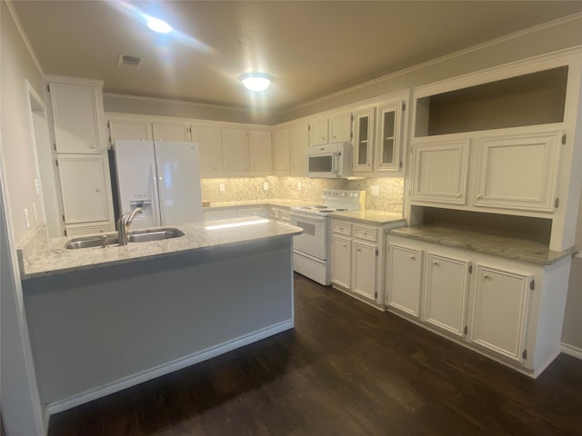 kitchen featuring white appliances, white cabinets, and dark hardwood / wood-style floors