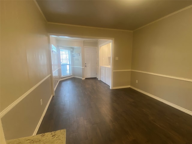 unfurnished room with dark hardwood / wood-style flooring and crown molding