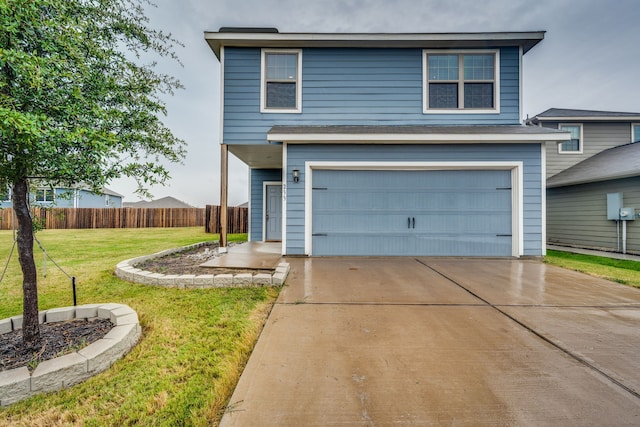 front of property with a front lawn and a garage