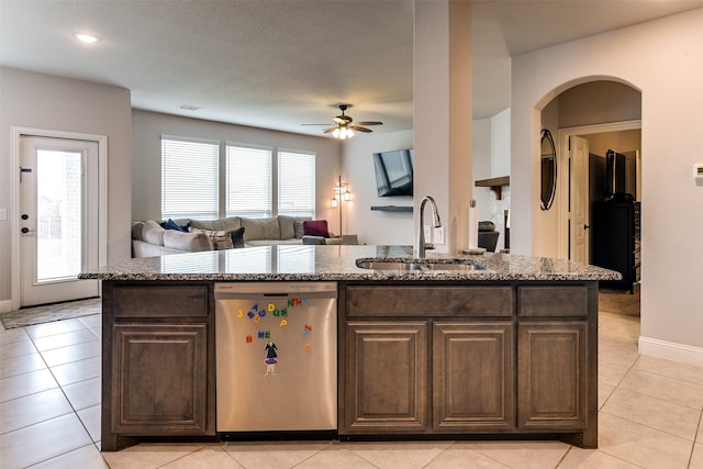 kitchen with plenty of natural light, stainless steel dishwasher, ceiling fan, and sink