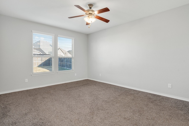 spare room featuring carpet flooring and ceiling fan