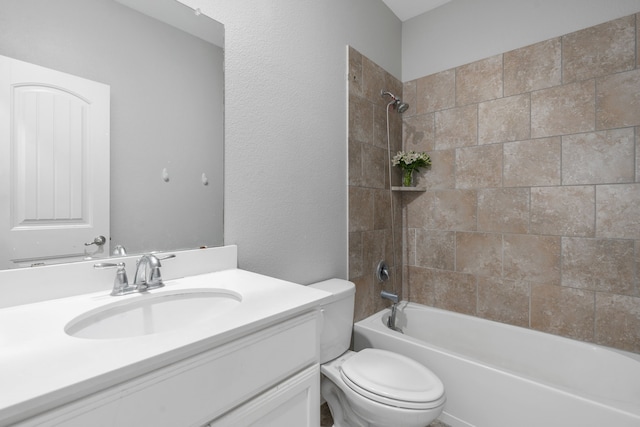 full bathroom featuring vanity, toilet, and tiled shower / bath combo