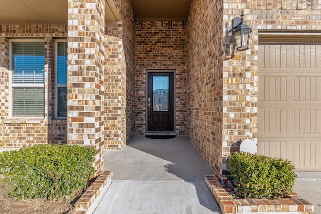 doorway to property featuring a garage