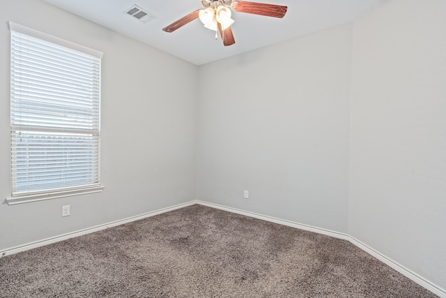 unfurnished room featuring carpet floors and ceiling fan