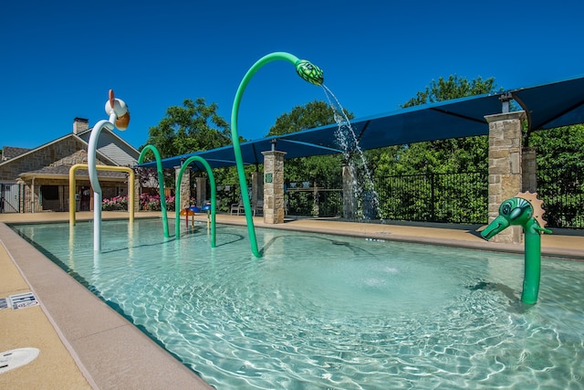 view of swimming pool featuring a patio area