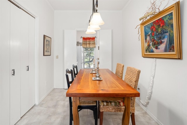 dining area featuring crown molding