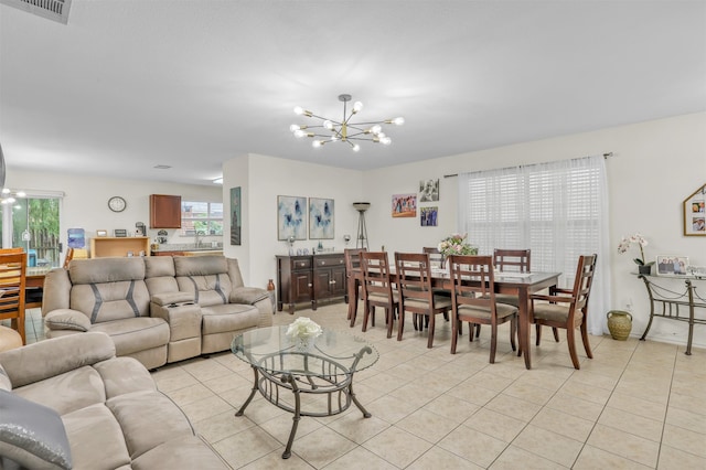 tiled living room featuring a notable chandelier