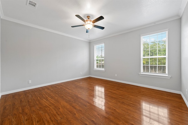 spare room with wood-type flooring, ceiling fan, and ornamental molding