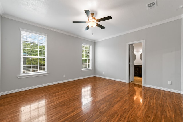 unfurnished room with hardwood / wood-style flooring, ceiling fan, and crown molding