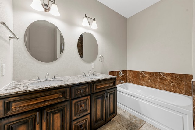 bathroom featuring a washtub and vanity