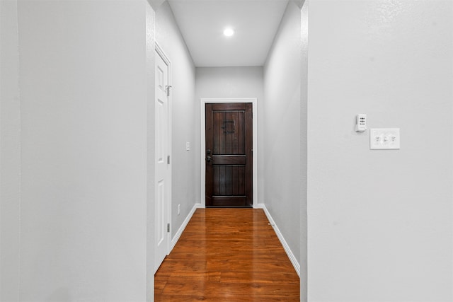 corridor with dark wood-type flooring