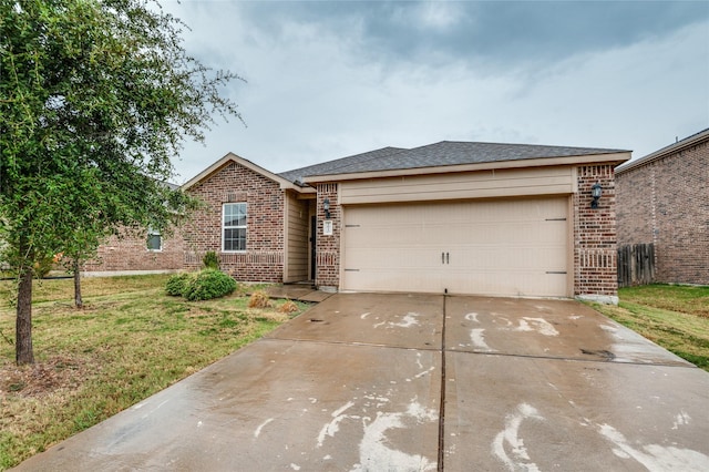 ranch-style home featuring a front lawn, brick siding, a garage, and driveway