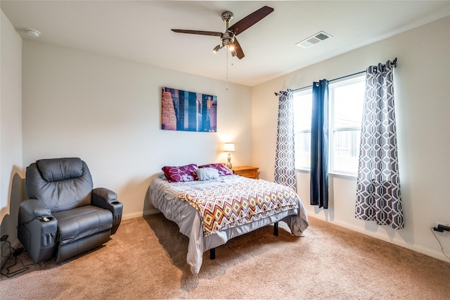 bedroom featuring carpet flooring, baseboards, visible vents, and ceiling fan