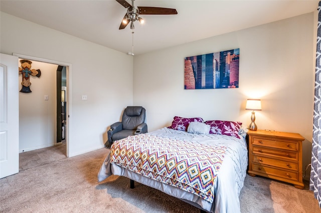 bedroom featuring a ceiling fan, carpet, and baseboards