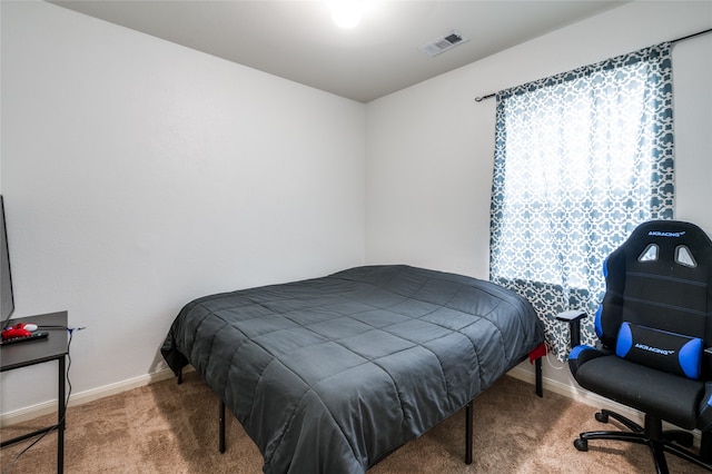 bedroom featuring dark colored carpet