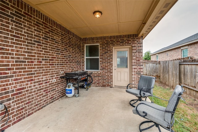 view of patio / terrace featuring fence