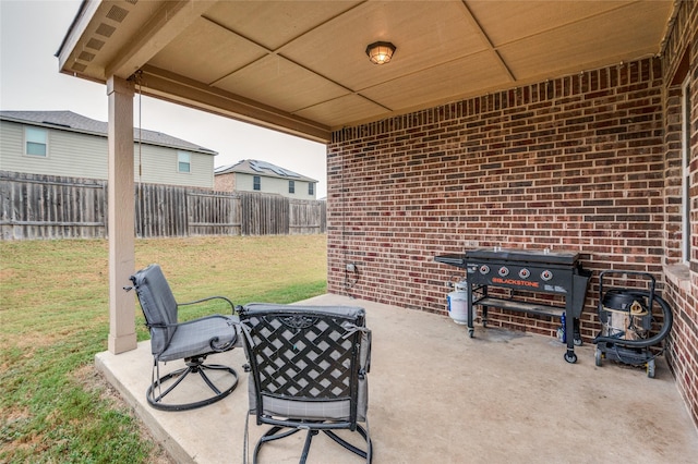 view of patio featuring fence