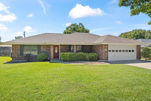 single story home with a garage and a front lawn