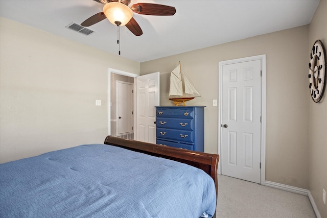 bedroom with ceiling fan and light carpet