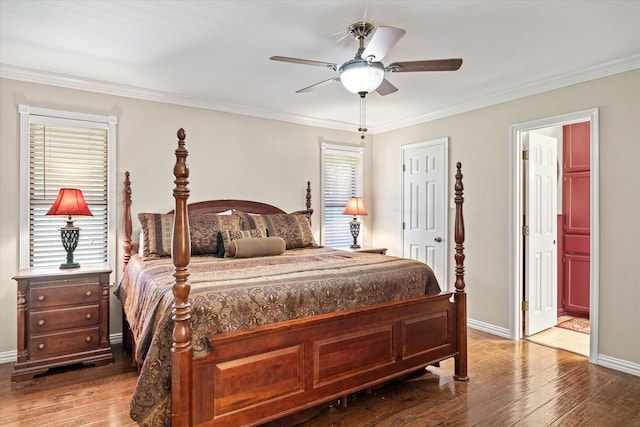 bedroom featuring multiple windows, ceiling fan, hardwood / wood-style flooring, and ornamental molding