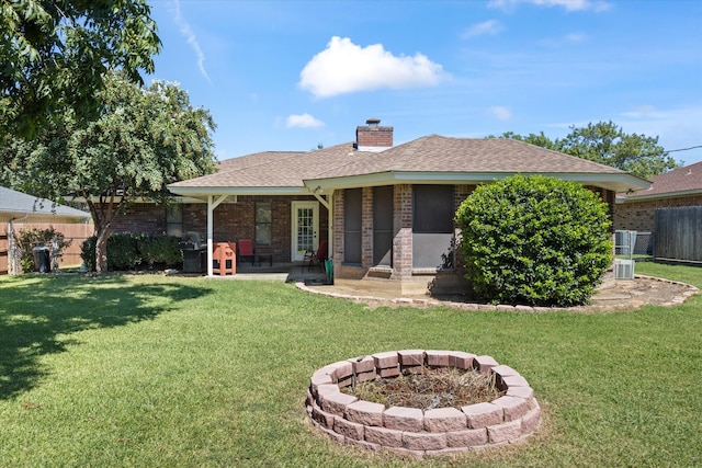 back of house with a yard and a patio area