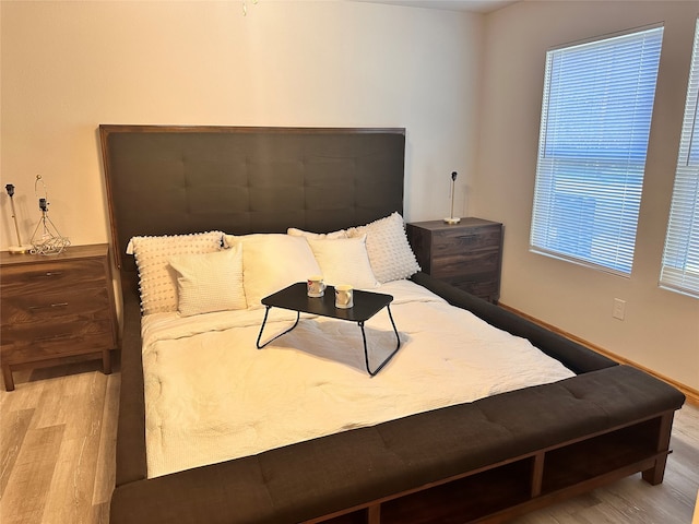 bedroom with light hardwood / wood-style flooring