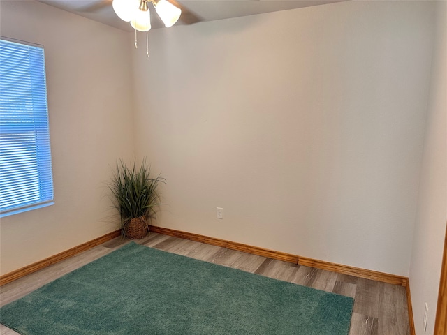 unfurnished room with wood-type flooring and ceiling fan