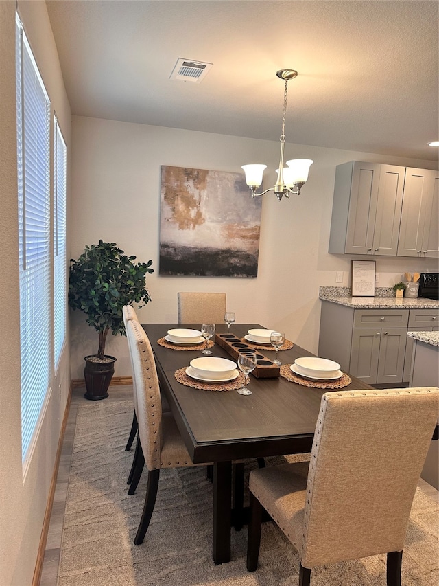 dining room with a notable chandelier