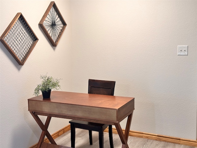 office with hardwood / wood-style flooring