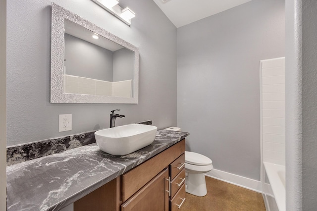 bathroom featuring tile patterned floors, vanity, and toilet