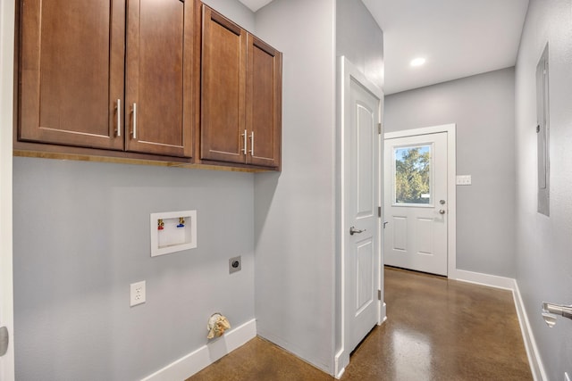 washroom with hookup for an electric dryer, cabinets, and washer hookup