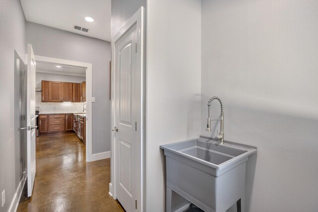 kitchen featuring sink and backsplash