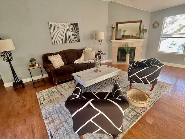 4613 Saint Thomas Pl, Fort Worth, TX 76135 - living area with baseboards, a tiled fireplace, wood finished floors, and lofted ceiling