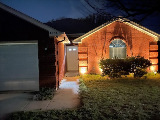 4613 Saint Thomas Pl, Fort Worth, TX 76135 - exterior entry at twilight featuring brick siding