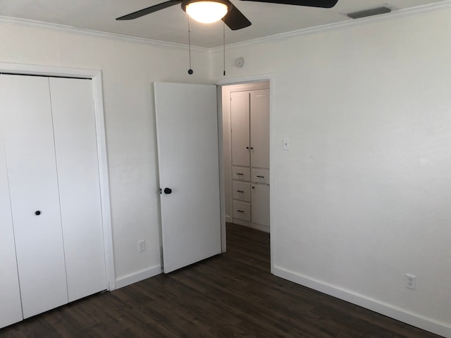 unfurnished bedroom featuring crown molding, ceiling fan, and dark hardwood / wood-style floors