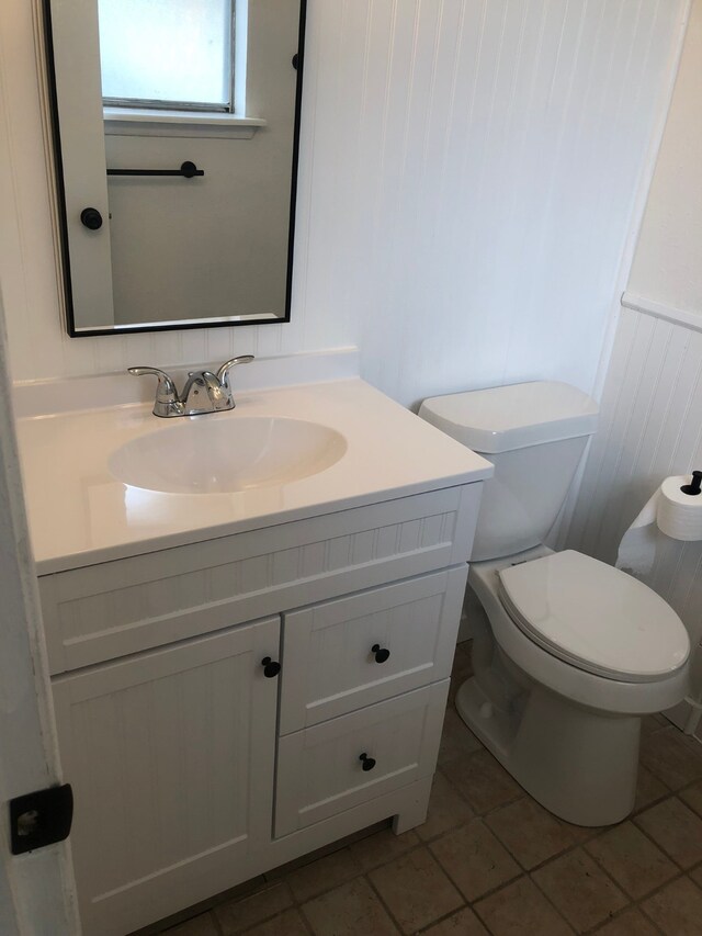 bathroom featuring toilet and vanity