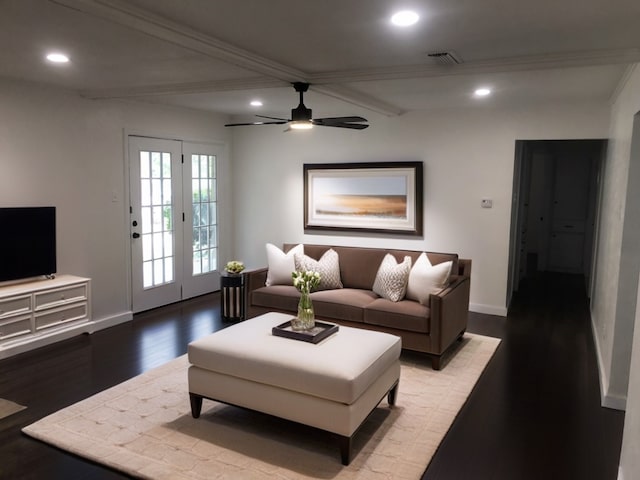 living room with ceiling fan, hardwood / wood-style flooring, beam ceiling, and french doors