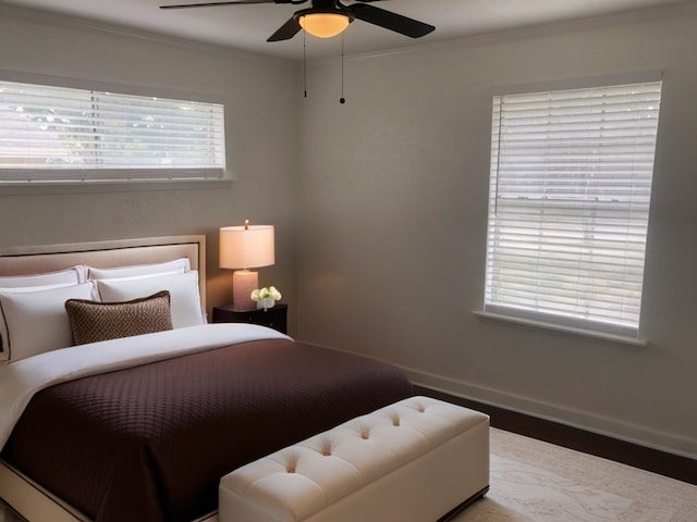 bedroom featuring ornamental molding and ceiling fan