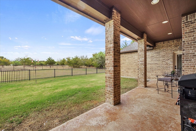 view of yard featuring a patio area and a fenced backyard