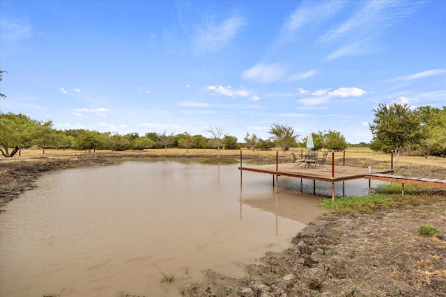 dock area featuring a water view and a rural view