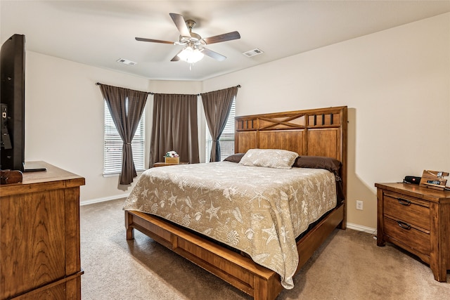 bedroom with light colored carpet and ceiling fan