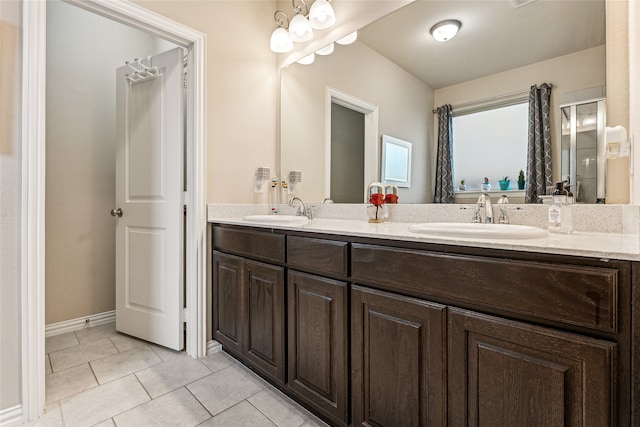 bathroom with tile patterned floors and vanity