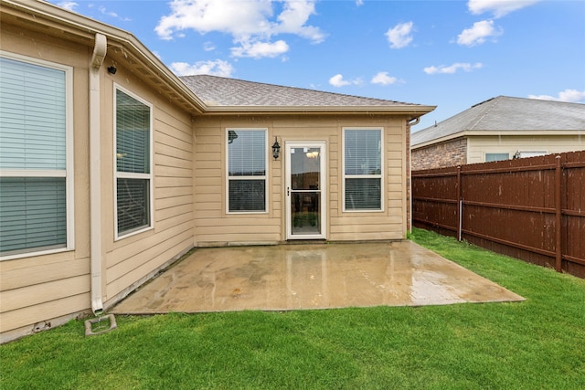 exterior space with a patio and a yard