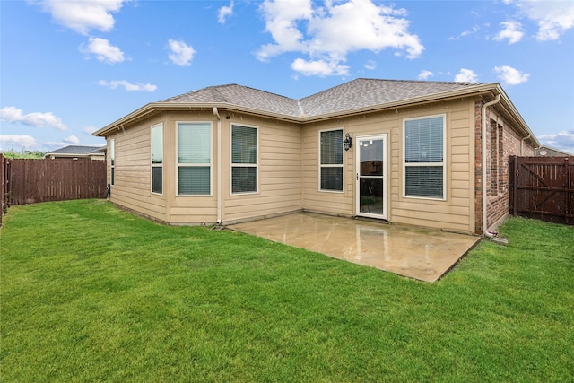 back of property featuring a patio and a lawn