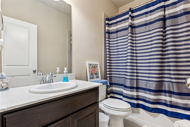 full bathroom featuring vanity, shower / bath combo, and toilet