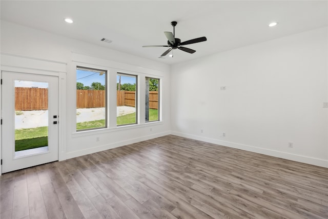 unfurnished room featuring ceiling fan and light hardwood / wood-style flooring