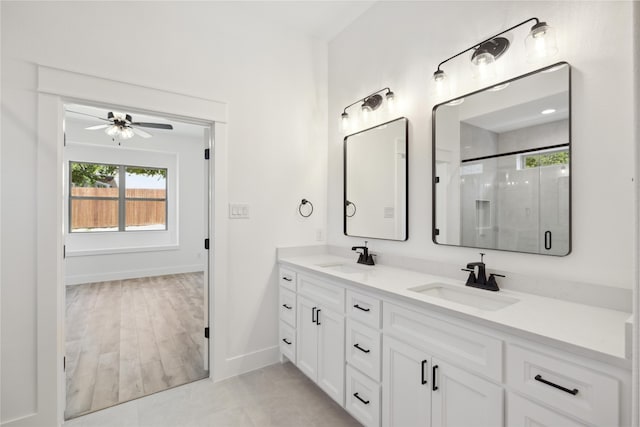 bathroom featuring ceiling fan, walk in shower, wood-type flooring, and vanity