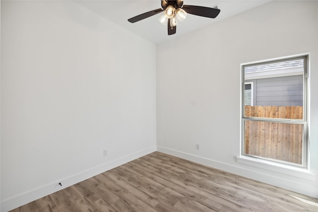 unfurnished room with hardwood / wood-style floors and ceiling fan